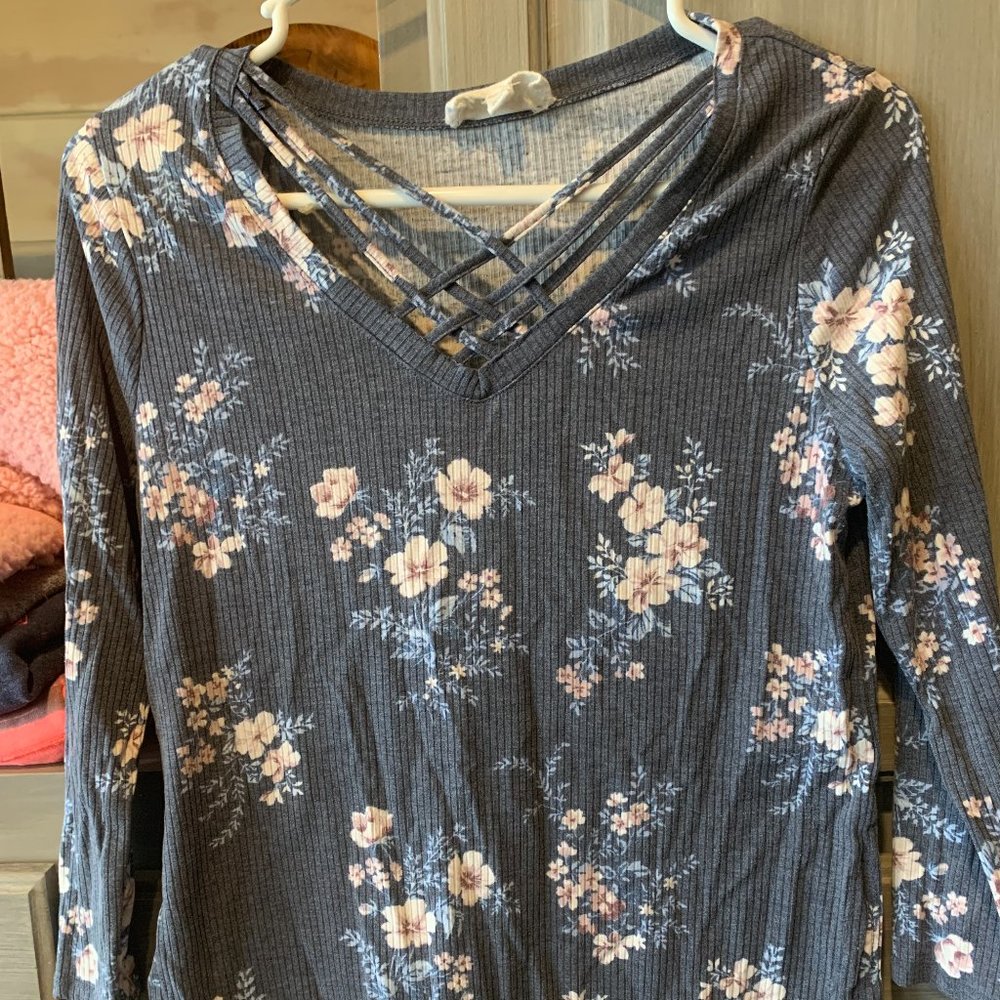 two criss cross long sleeve flower shirts